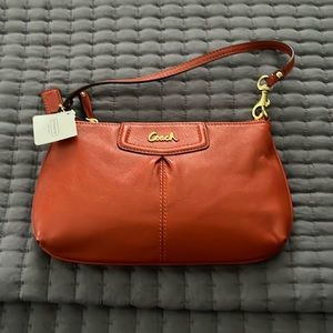 NWT Coach orange leather clutch bag - super cute & very versatile!